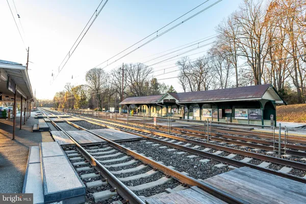a view of a yard with wooden fence