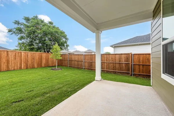 a backyard of a house with lots of green space
