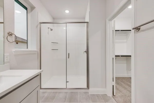 a bathroom with a double vanity sink and mirror