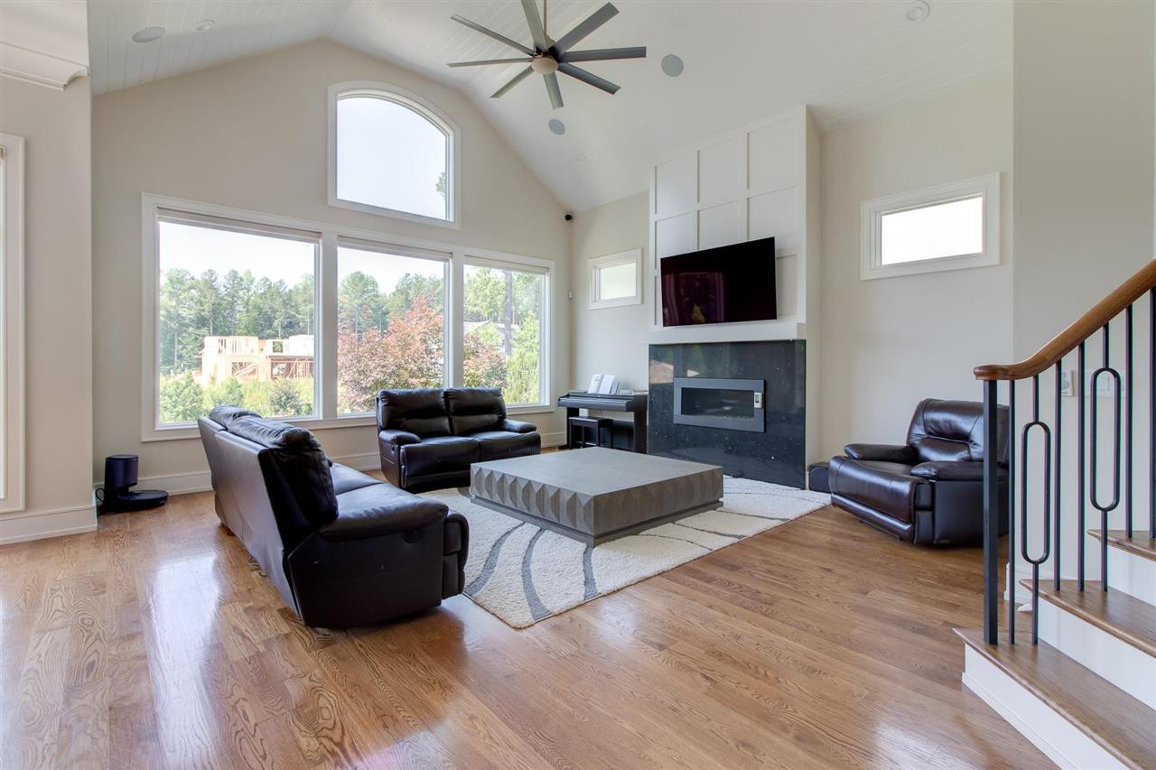 136 Turner Ridge Circle Durham, NC 27713 - Photo 13 of 30 a living room with fireplace furniture and a flat screen tv