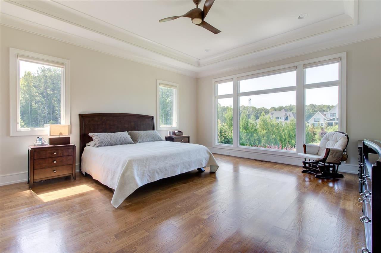 136 Turner Ridge Circle Durham, NC 27713 - Photo 17 of 30 a bedroom with a bed and a large window