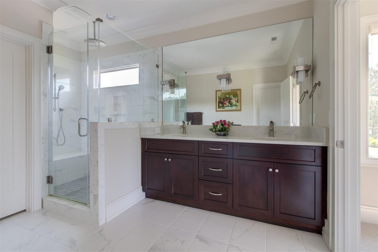 136 Turner Ridge Circle Durham, NC 27713 - Photo 27 of 30 a spacious bathroom with a granite countertop sink mirror and shower