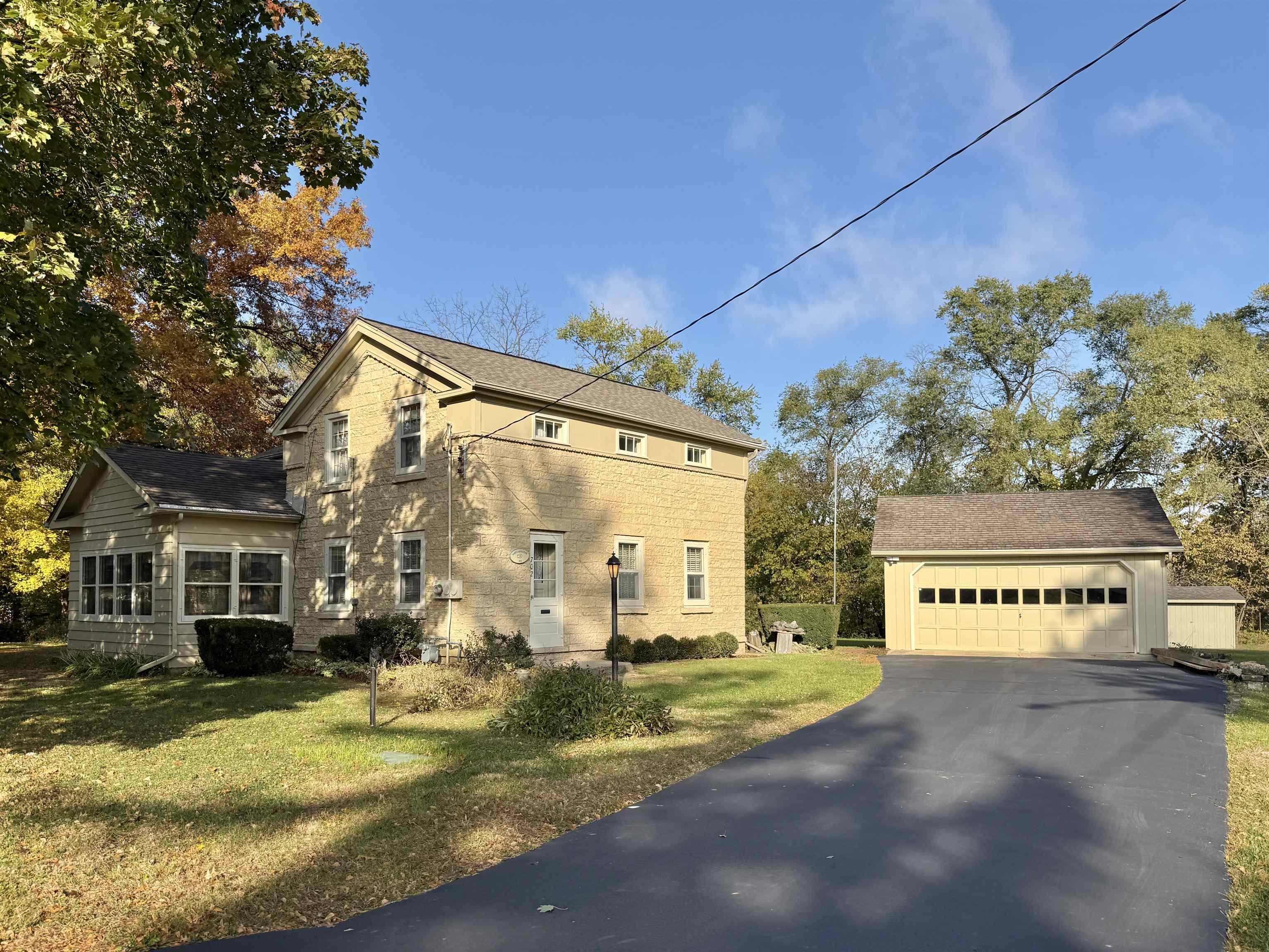 702 Washington Street Rockton, IL 61072 - Photo 1 of 29 a view of a house with a yard and potted plants
