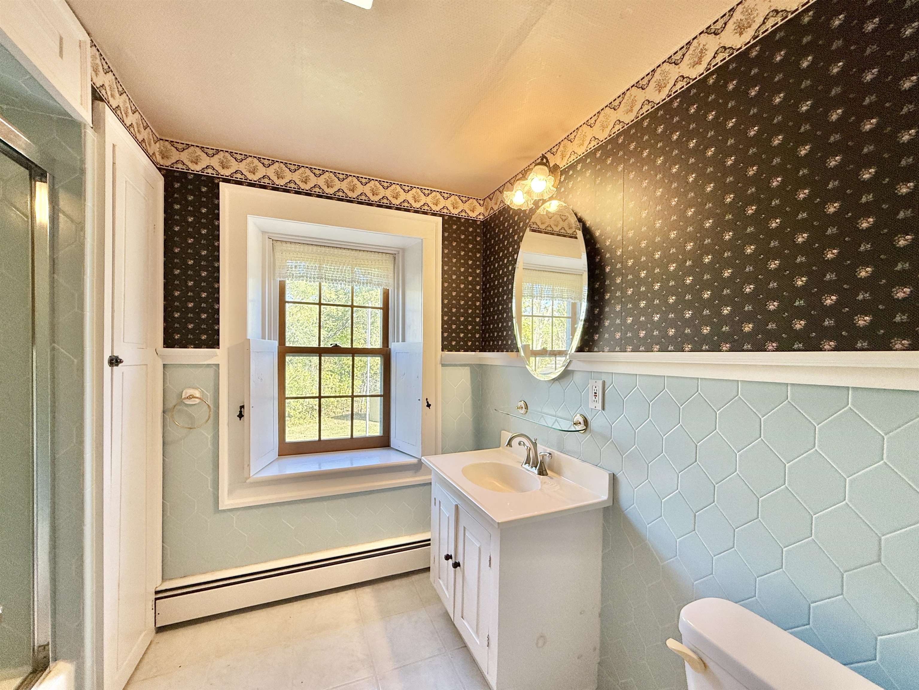 702 Washington Street Rockton, IL 61072 - Photo 22 of 29 a bathroom with a sink and a mirror