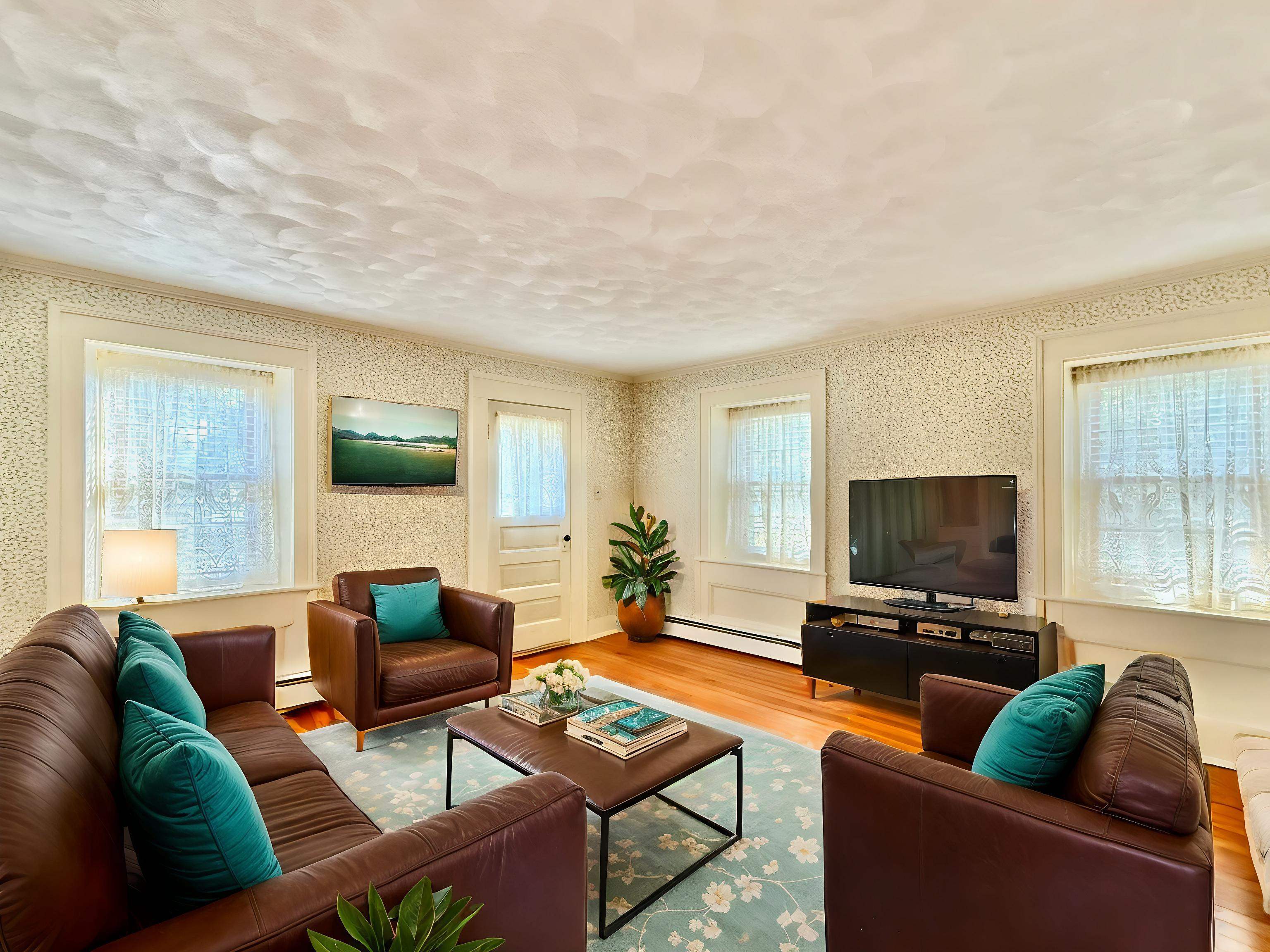 702 Washington Street Rockton, IL 61072 - Photo 4 of 29 a living room with furniture and a flat screen tv with wooden floor