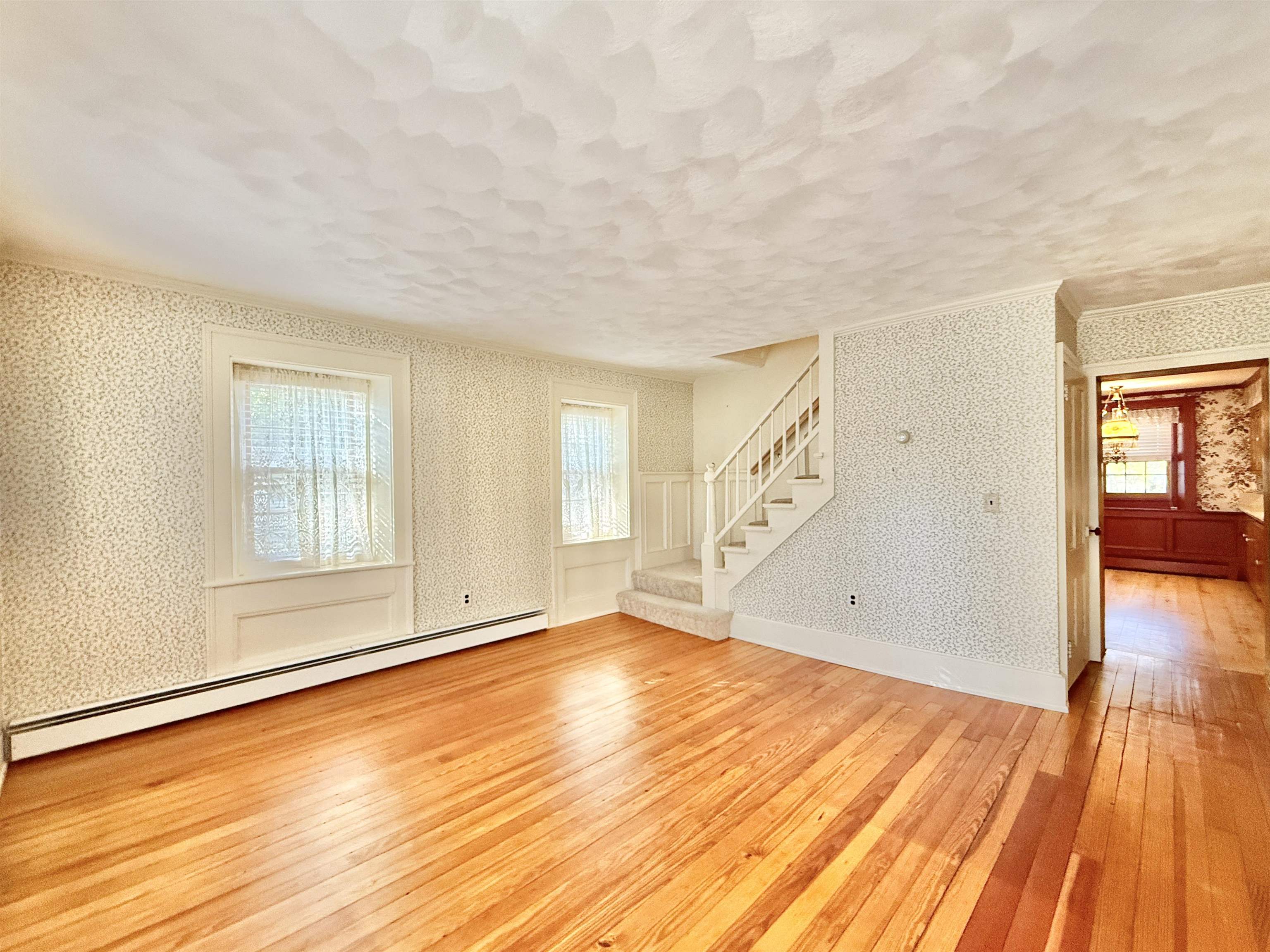 702 Washington Street Rockton, IL 61072 - Photo 5 of 29 a view of an empty room with wooden floor and a window