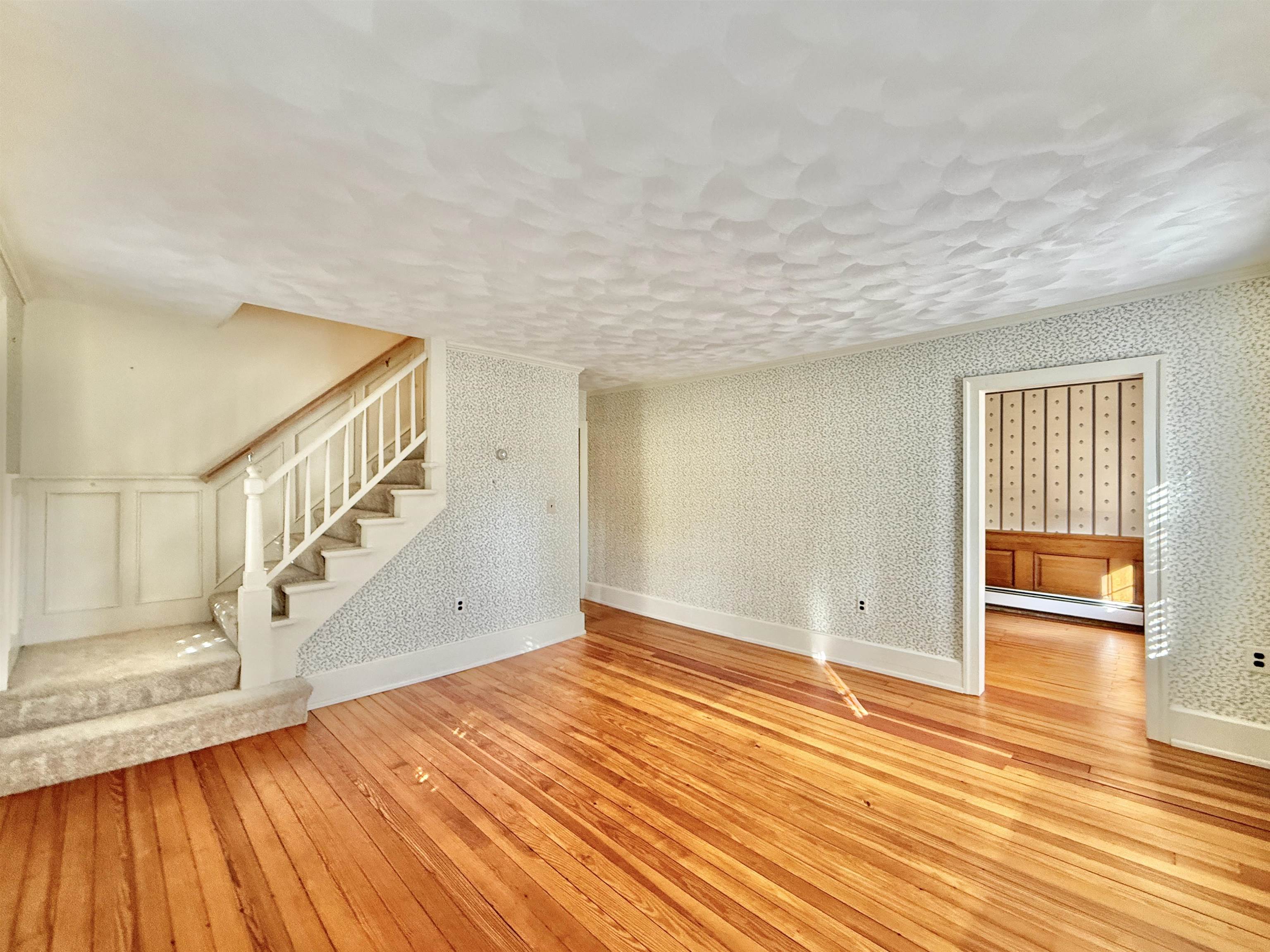 702 Washington Street Rockton, IL 61072 - Photo 6 of 29 a view of an empty room with wooden floor