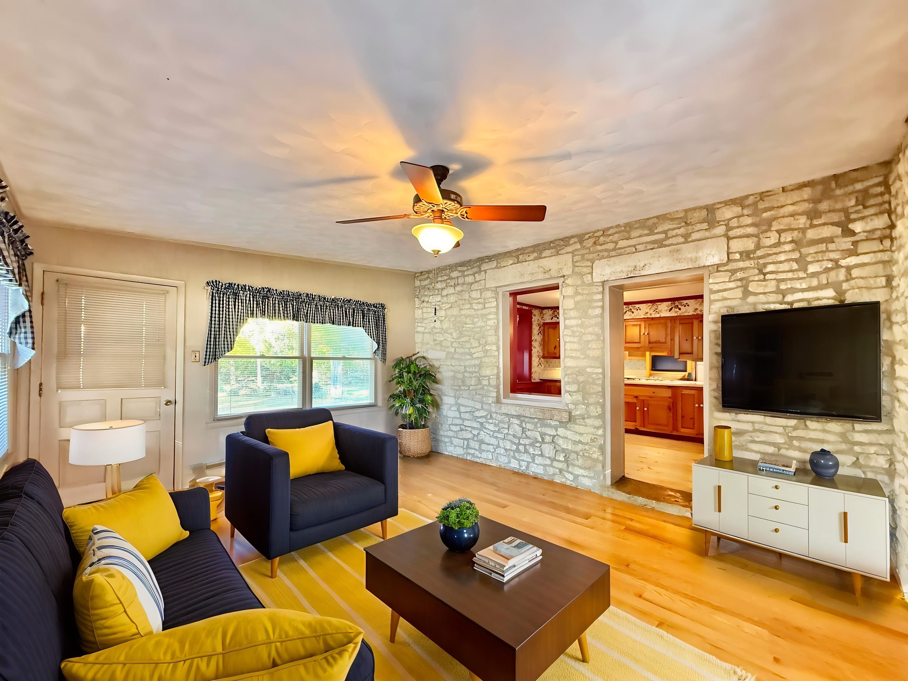 702 Washington Street Rockton, IL 61072 - Photo 10 of 29 a living room with furniture and a flat screen tv