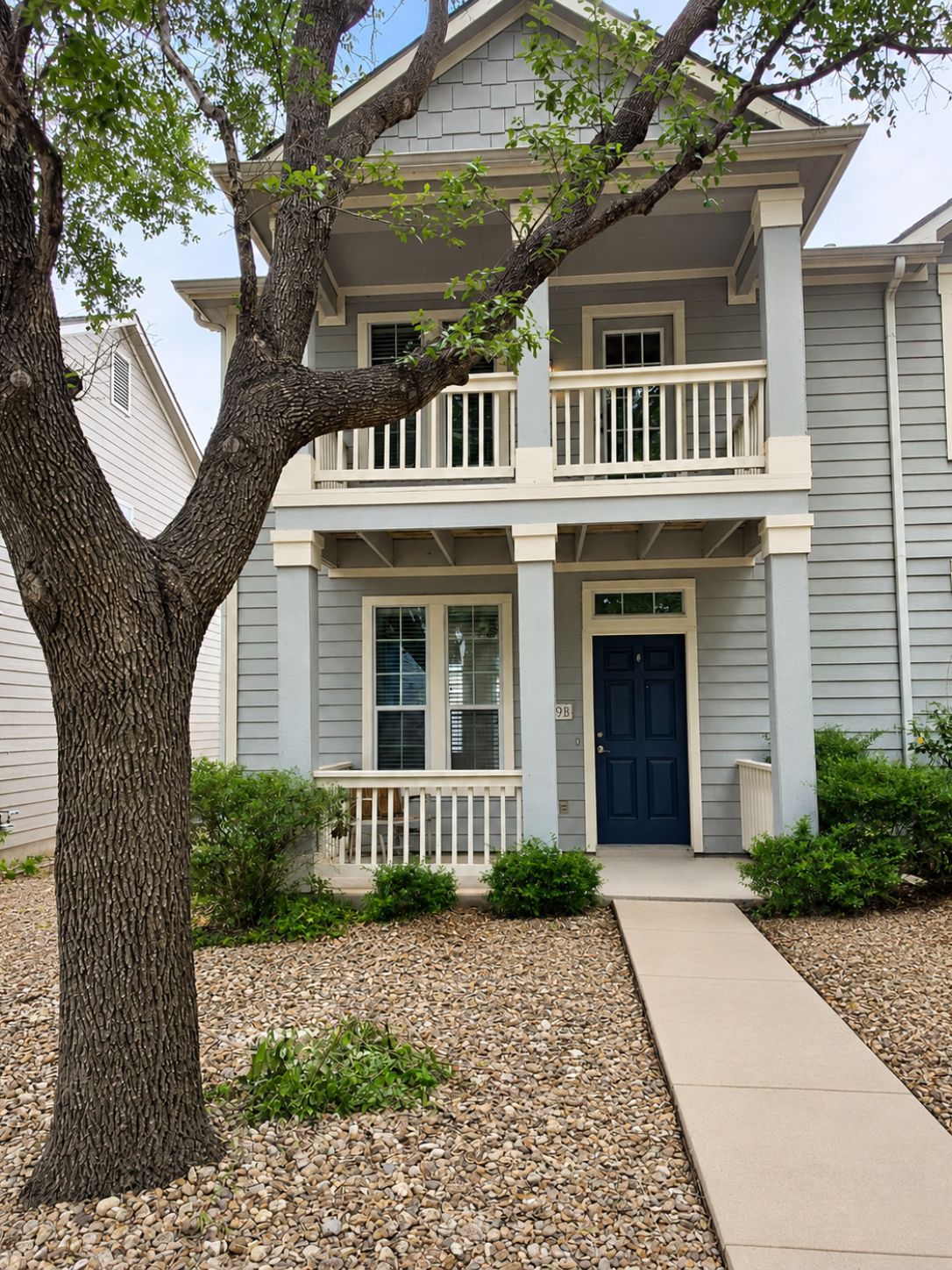 5679 Fergus, Unit B Kyle, TX 78640 - Photo 1 of 26 Craftsman details and a private balcony accent this classic multi-level residence entry.