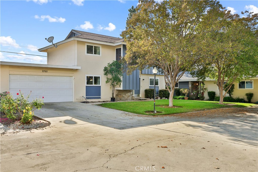 2702 College Lane La Verne, CA 91750 - Photo 1 of 53 a front view of a house with a yard and a garage