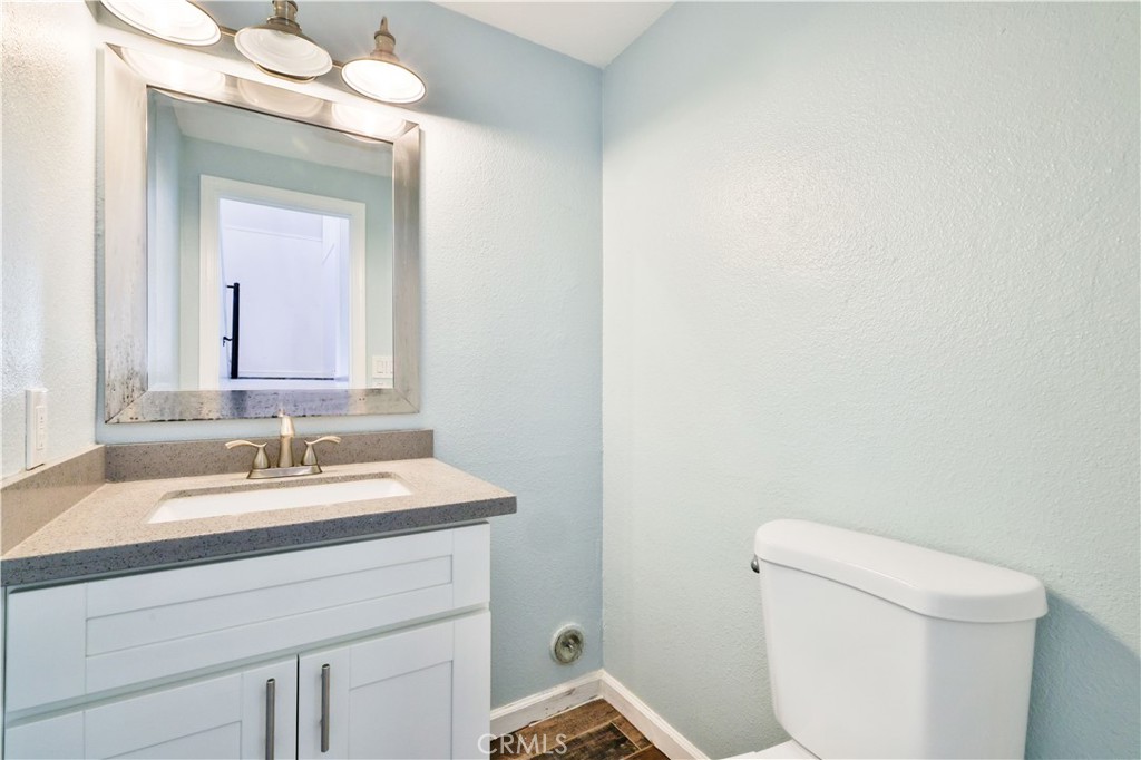 2702 College Lane La Verne, CA 91750 - Photo 15 of 53 a bathroom with a sink and a toilet