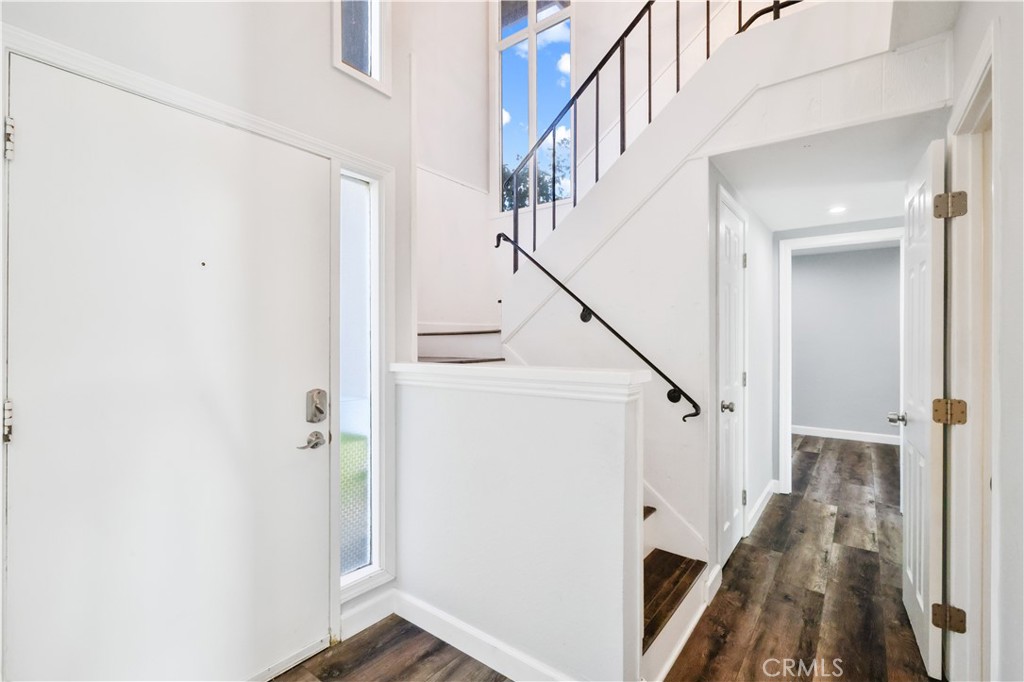 2702 College Lane La Verne, CA 91750 - Photo 16 of 53 a view of entryway with wooden floor and stairs