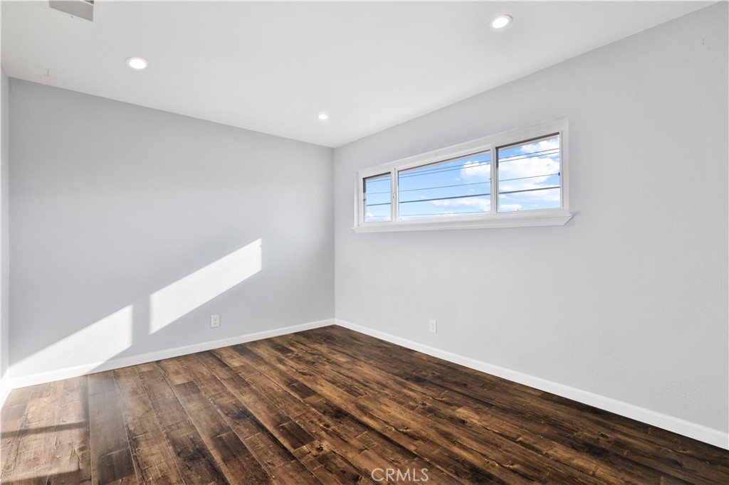 2702 College Lane La Verne, CA 91750 - Photo 20 of 53 a view of empty room with wooden floor