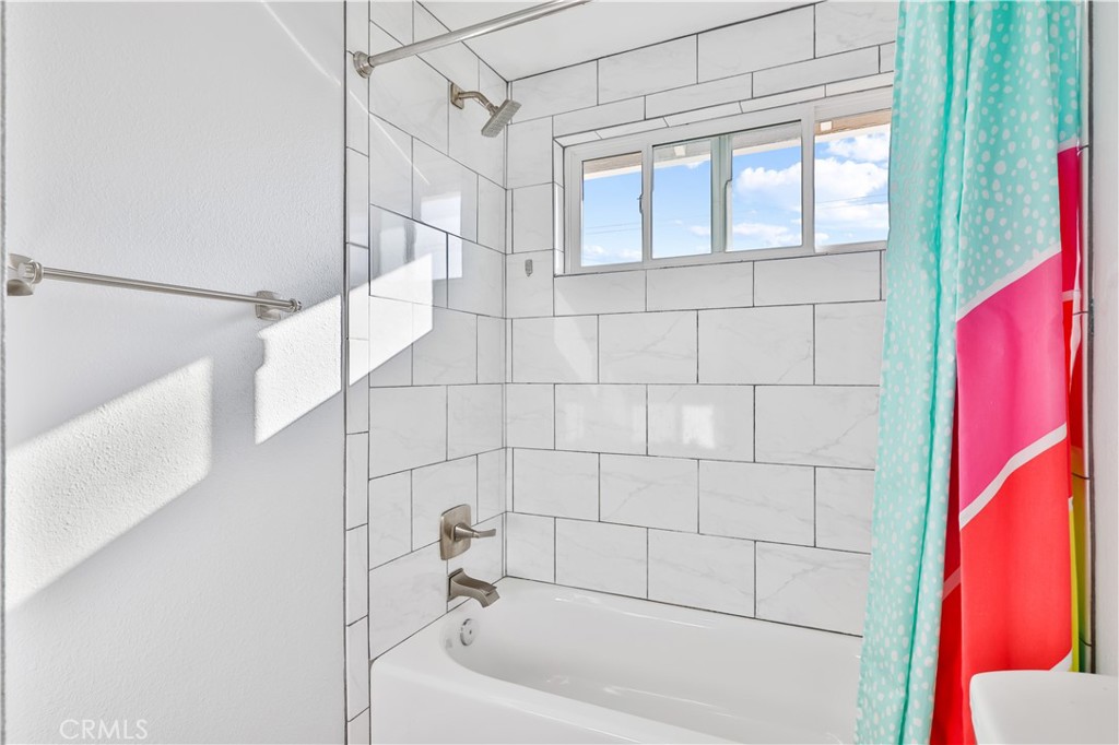 2702 College Lane La Verne, CA 91750 - Photo 23 of 53 a bathroom with a bathtub and shower