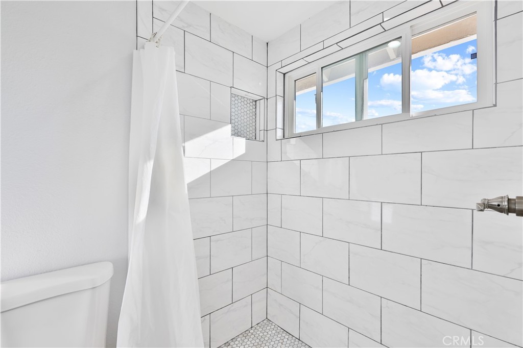 2702 College Lane La Verne, CA 91750 - Photo 28 of 53 a bathroom with a shower