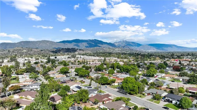 an aerial view of residential building and car parked