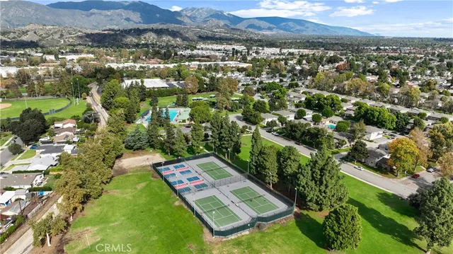 an aerial view of a house with garden space and street view
