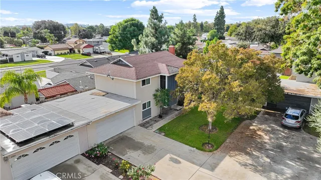an aerial view of a house having swimming pool