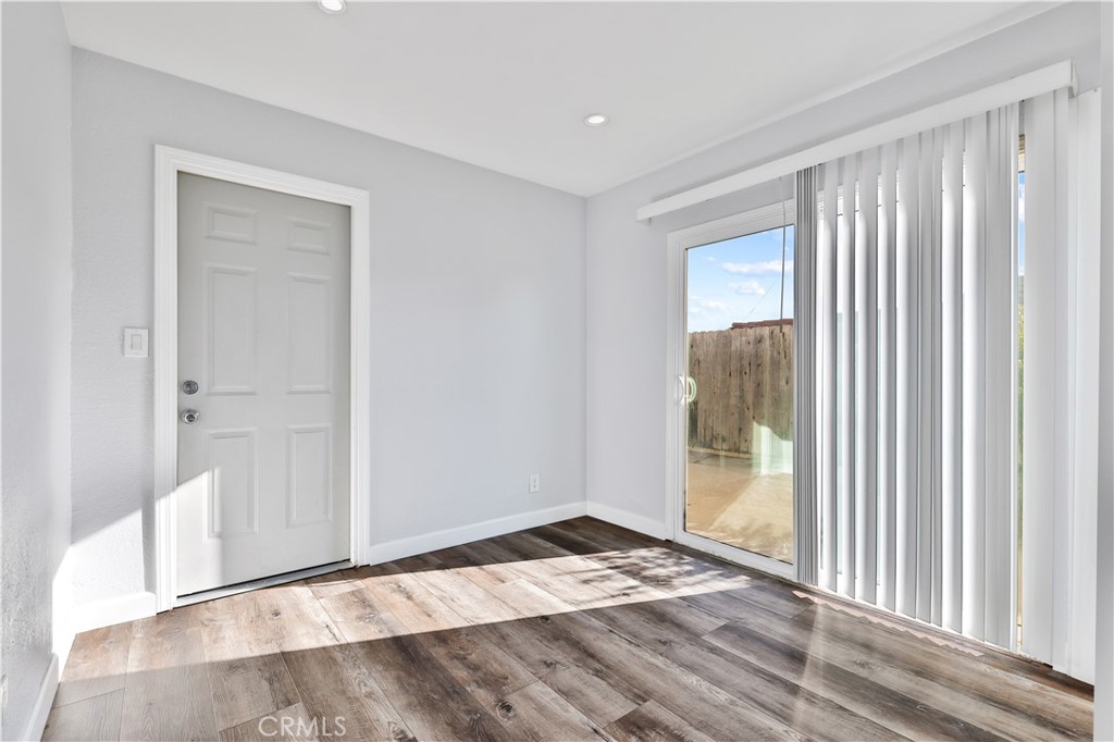 2702 College Lane La Verne, CA 91750 - Photo 7 of 53 a view of an empty room with wooden floor and a window