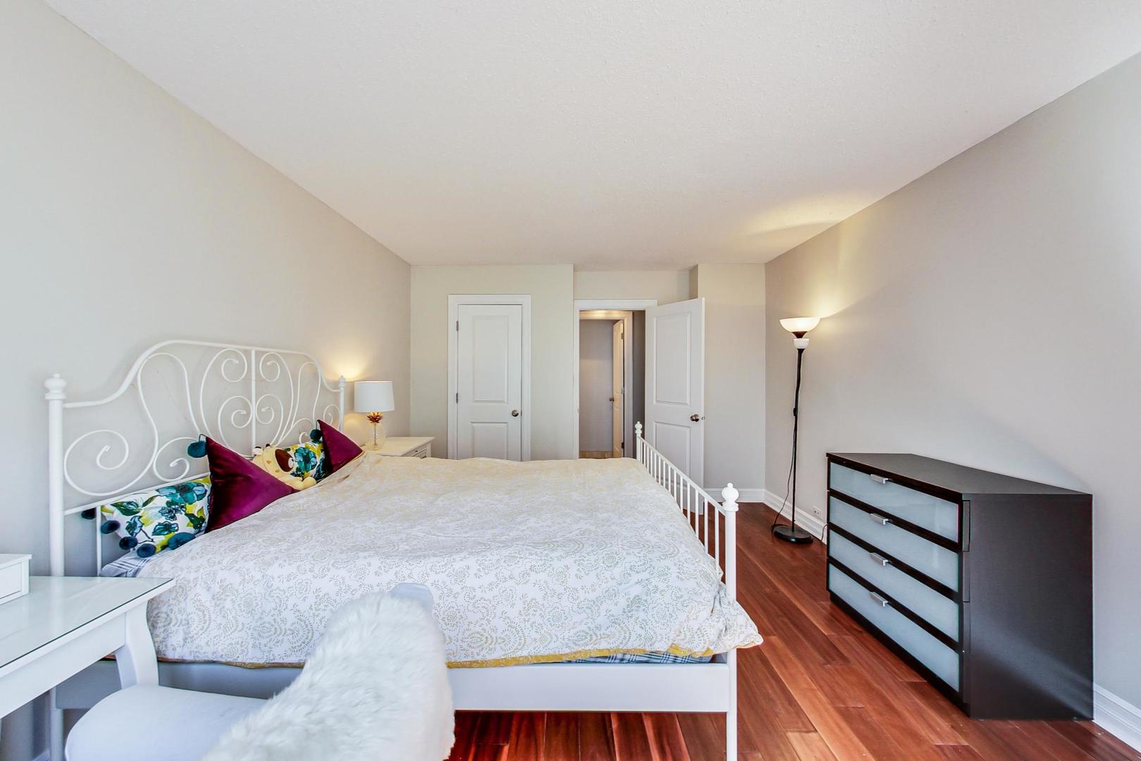 2930 North Sheridan Road, Unit 811 Chicago, IL 60657 - Photo 29 of 52 a bed room with a bed and a couch