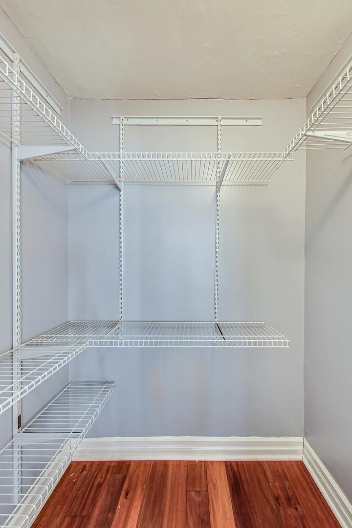 2930 North Sheridan Road, Unit 811 Chicago, IL 60657 - Photo 30 of 52 a view of walk in closet with wooden floor