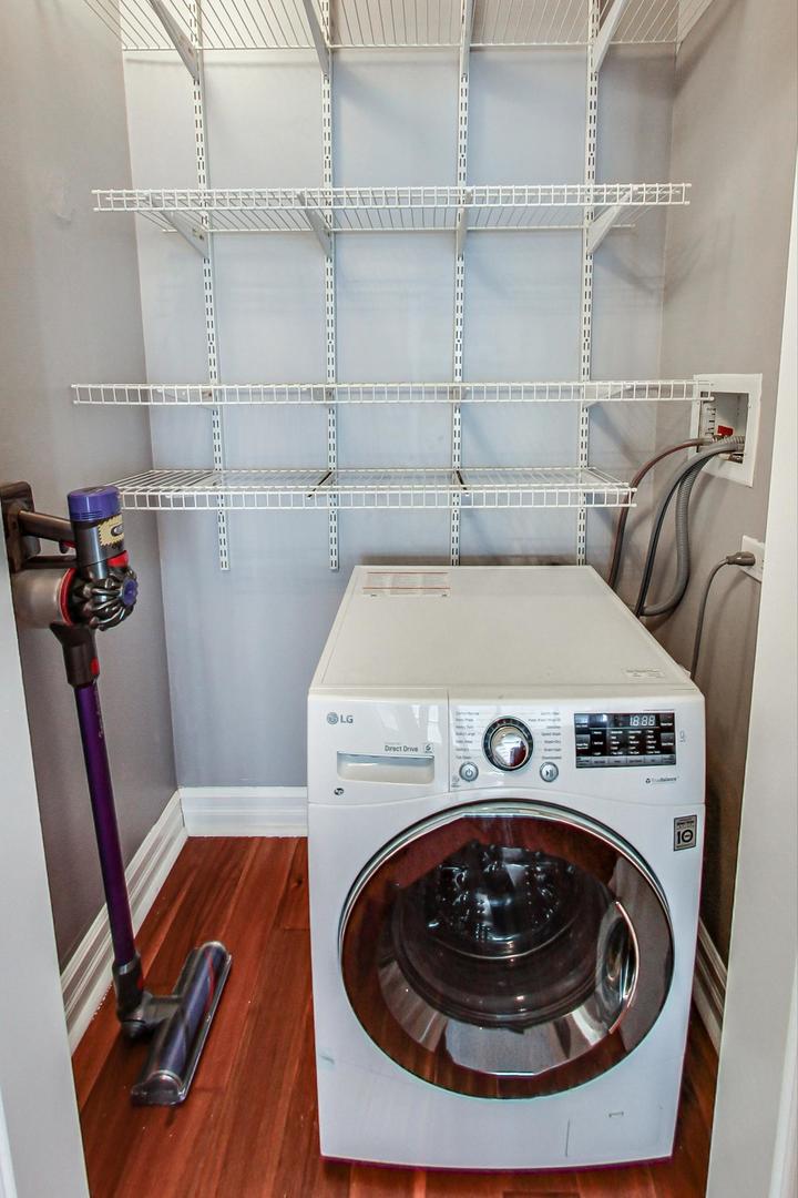 2930 North Sheridan Road, Unit 811 Chicago, IL 60657 - Photo 33 of 52 a utility room with dryer and washer
