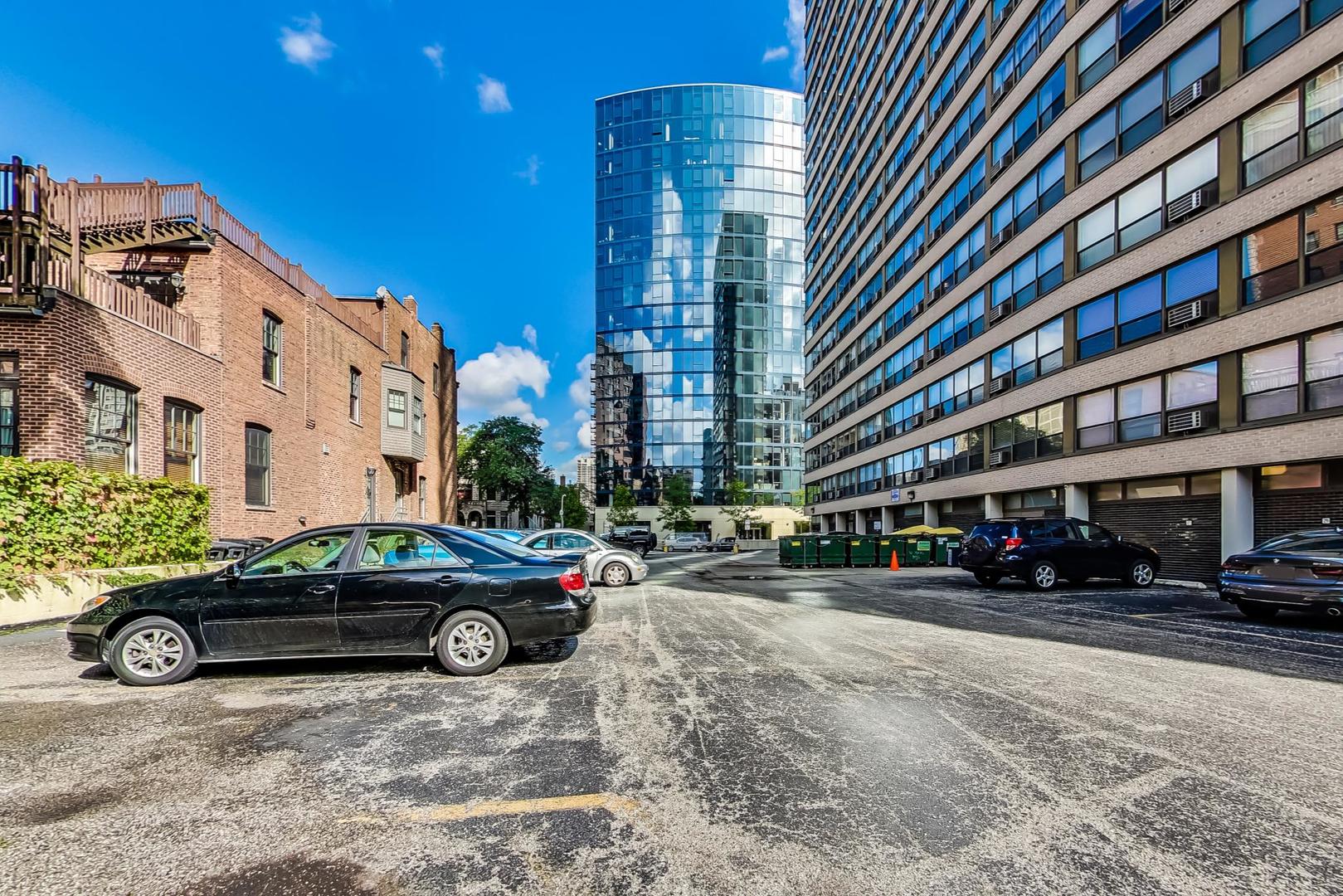 2930 North Sheridan Road, Unit 811 Chicago, IL 60657 - Photo 51 of 52 a car parked in front of a building