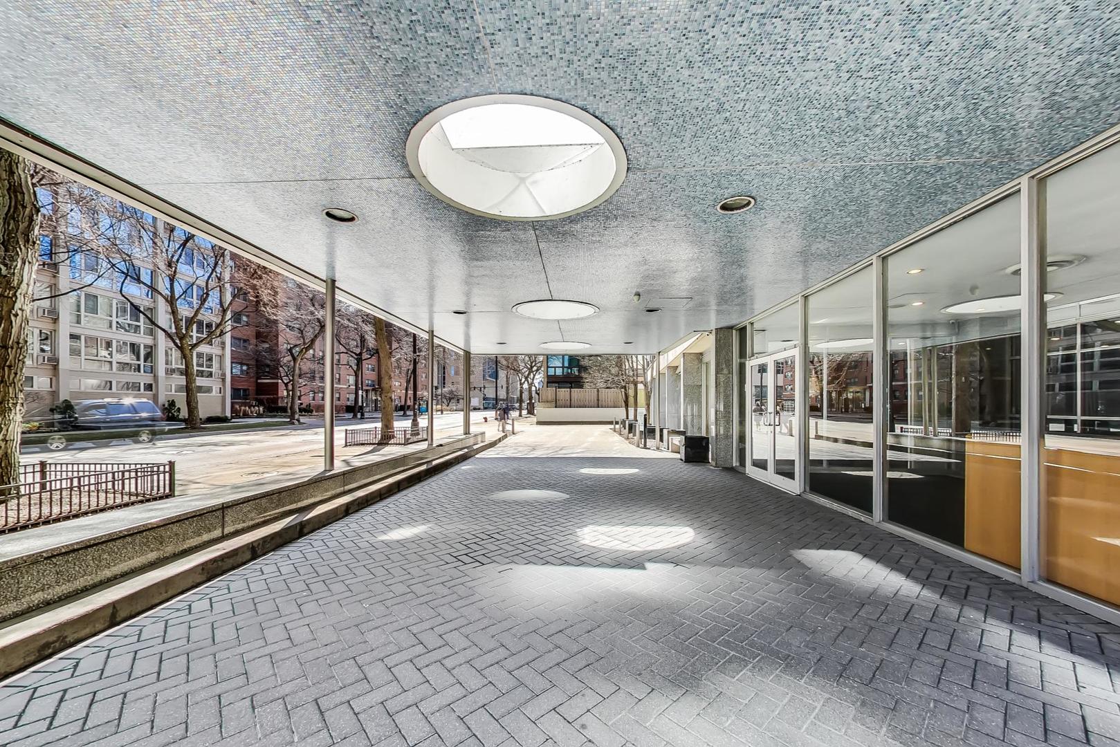 2930 North Sheridan Road, Unit 811 Chicago, IL 60657 - Photo 10 of 52 a view of a lobby with black carpet