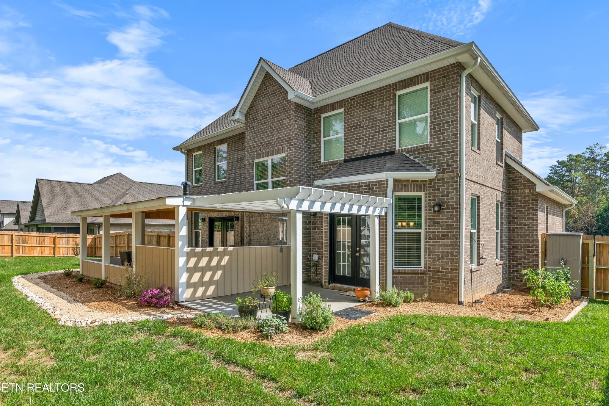 107 Crossroads Boulevard Oak Ridge, TN 37830 - Photo 21 of 23 a front view of a house with a yard table and chairs