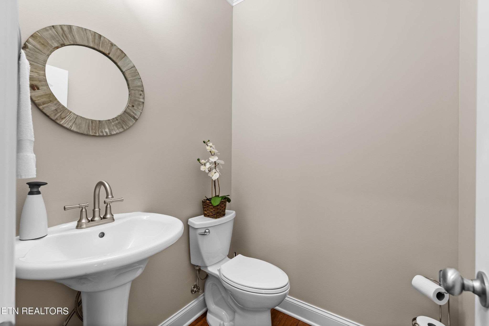 107 Crossroads Boulevard Oak Ridge, TN 37830 - Photo 10 of 23 a bathroom with a toilet a sink and a mirror