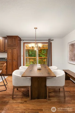 a view of a dining room with furniture window and outside view