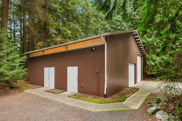 front view of a house with a tree