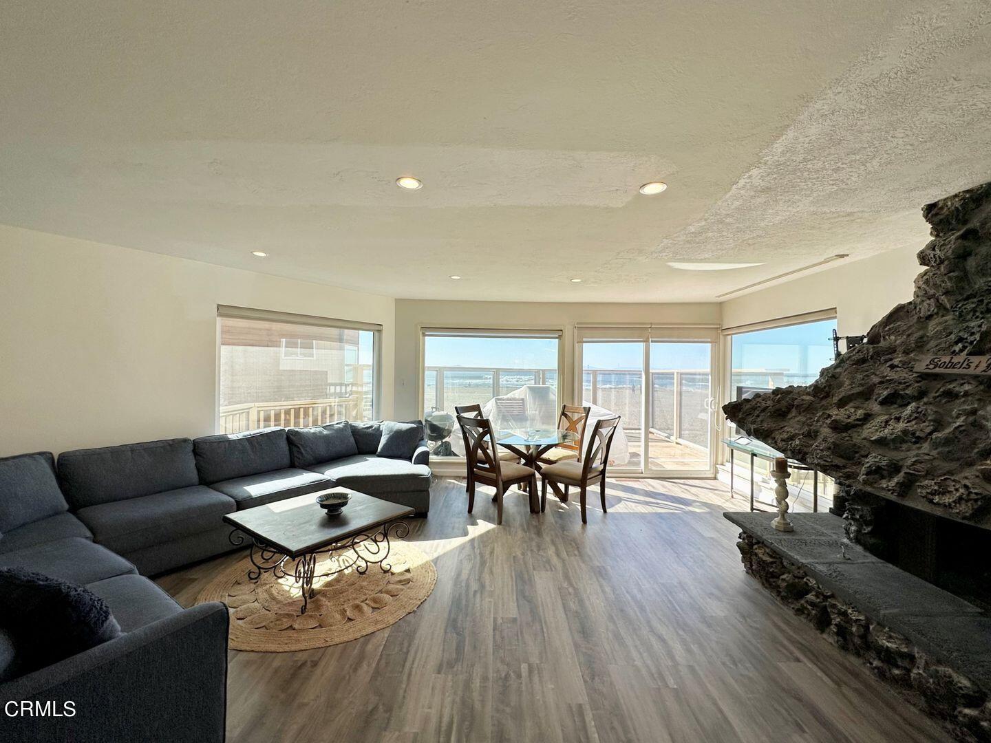 2201 Ocean Drive Oxnard, CA 93035 - Photo 11 of 30 a living room with furniture and wooden floor