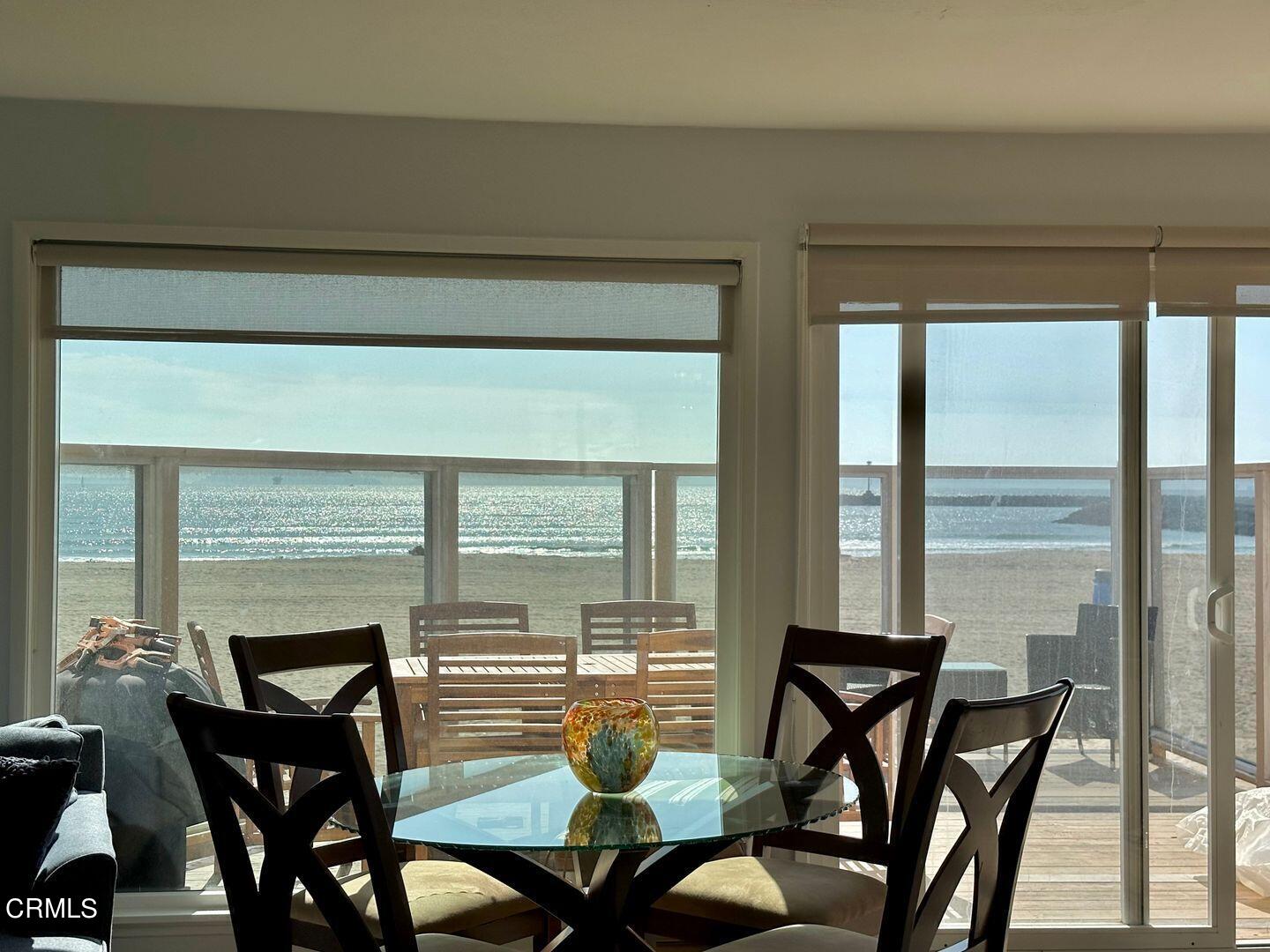2201 Ocean Drive Oxnard, CA 93035 - Photo 13 of 30 a view of a dining room with furniture window and outside view