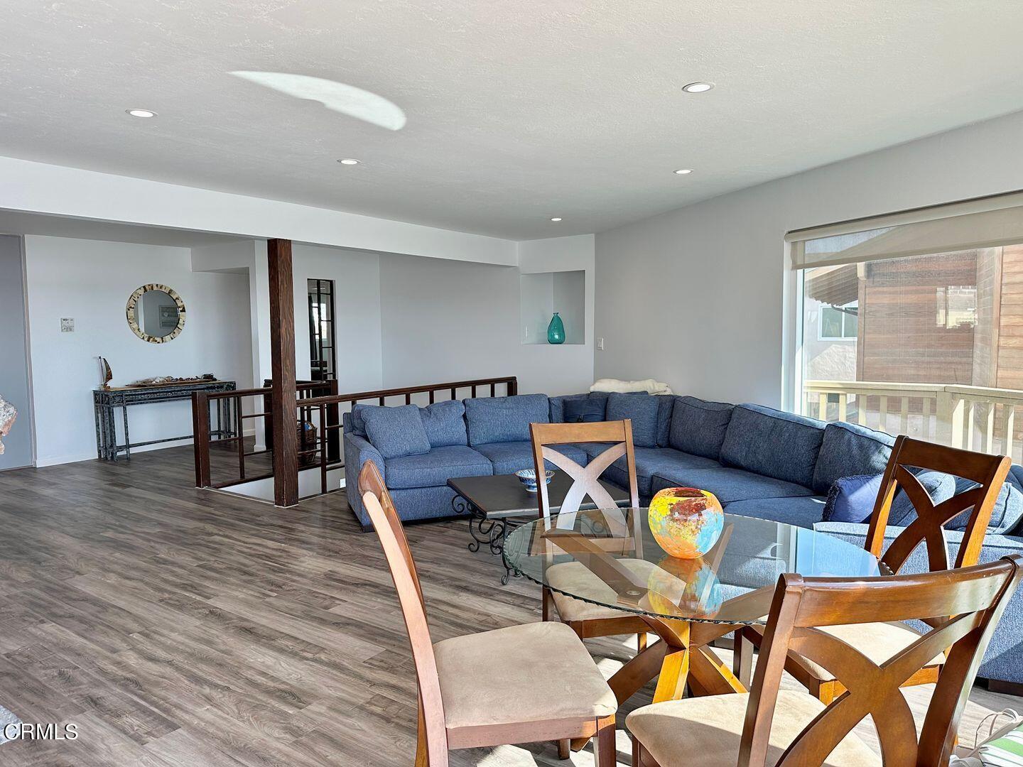 2201 Ocean Drive Oxnard, CA 93035 - Photo 18 of 30 a living room with furniture a dining table and wooden floor