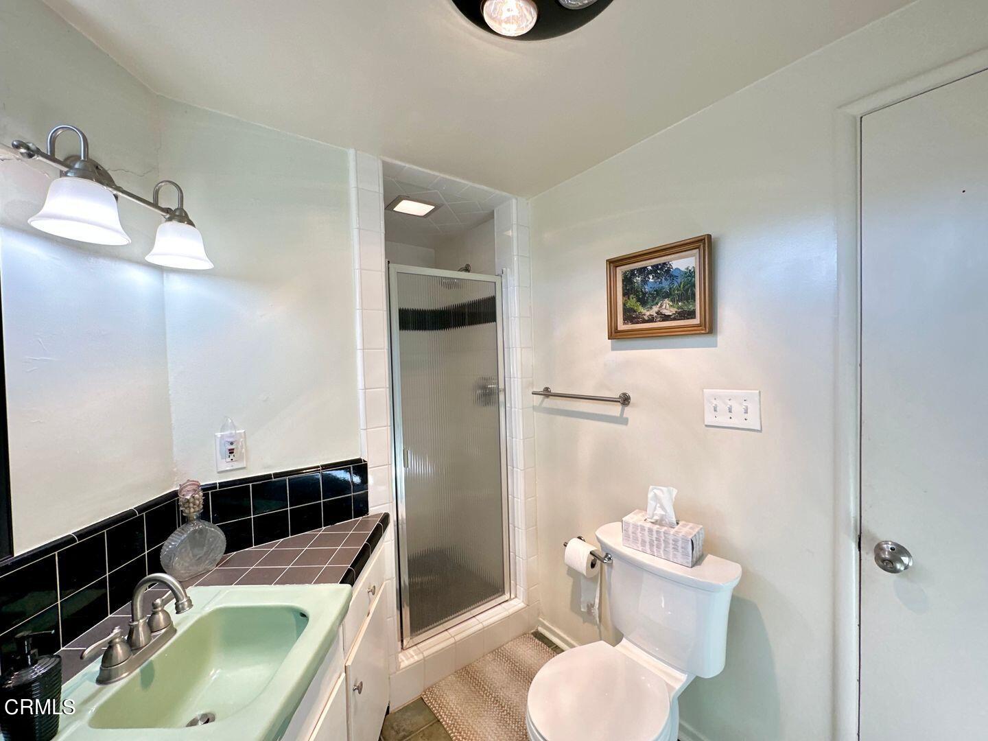 2201 Ocean Drive Oxnard, CA 93035 - Photo 22 of 30 a bathroom with a sink toilet and shower