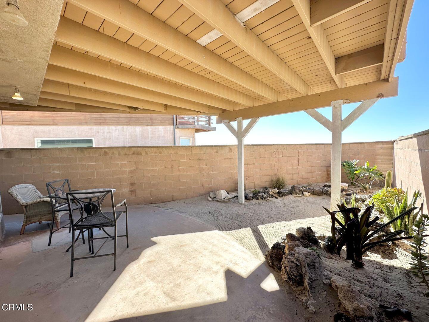 2201 Ocean Drive Oxnard, CA 93035 - Photo 28 of 30 a dining room with furniture and a floor to ceiling window