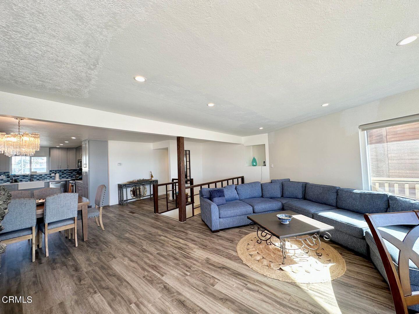 2201 Ocean Drive Oxnard, CA 93035 - Photo 9 of 30 a living room with furniture and wooden floor