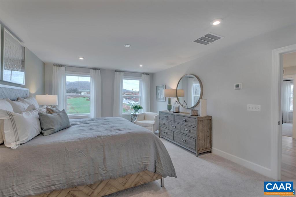 2837 Rambling Brook Lane Crozet, VA 22932 - Photo 17 of 24 a bed room with a bed and a dresser