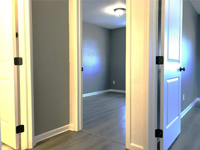 a view of an entryway with wooden floor