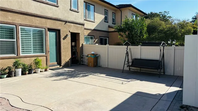 a view of a car park in front of house