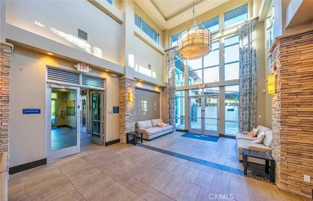 a living room with furniture a large window with outer view