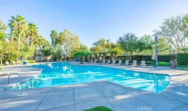 a view of a swimming pool with a patio