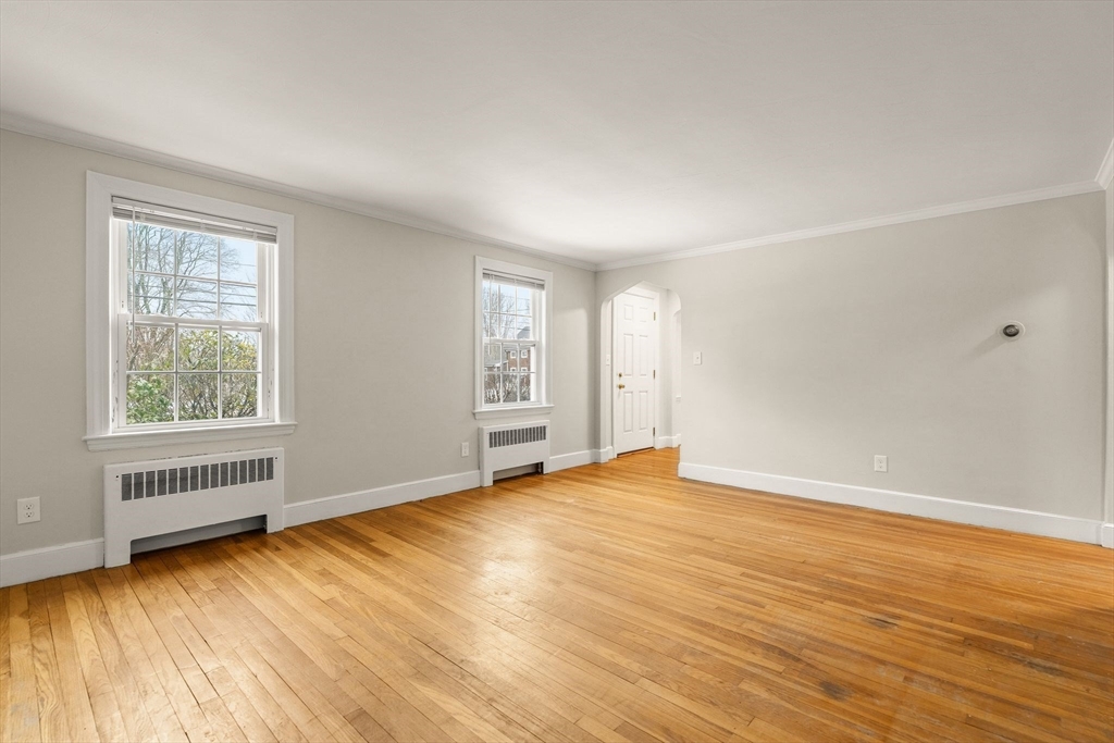 630 Pleasant Street Canton, MA 02021 - Photo 14 of 31 an empty room with wooden floor and windows
