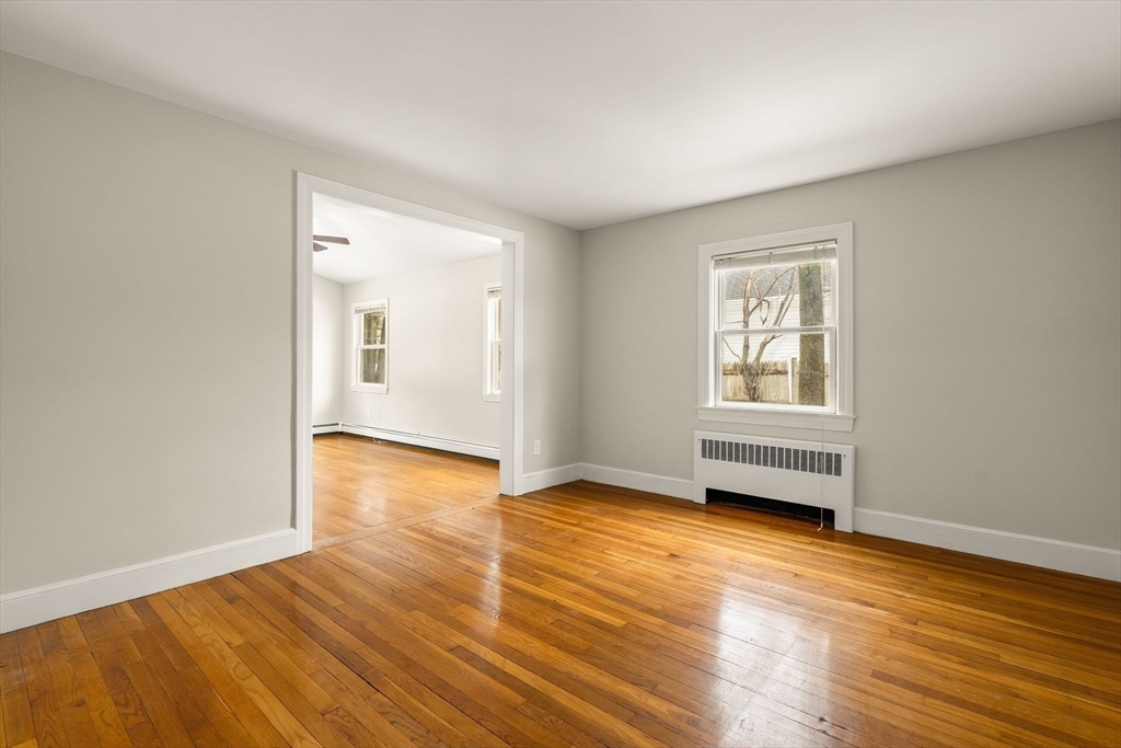 630 Pleasant Street Canton, MA 02021 - Photo 18 of 31 an empty room with wooden floor and windows