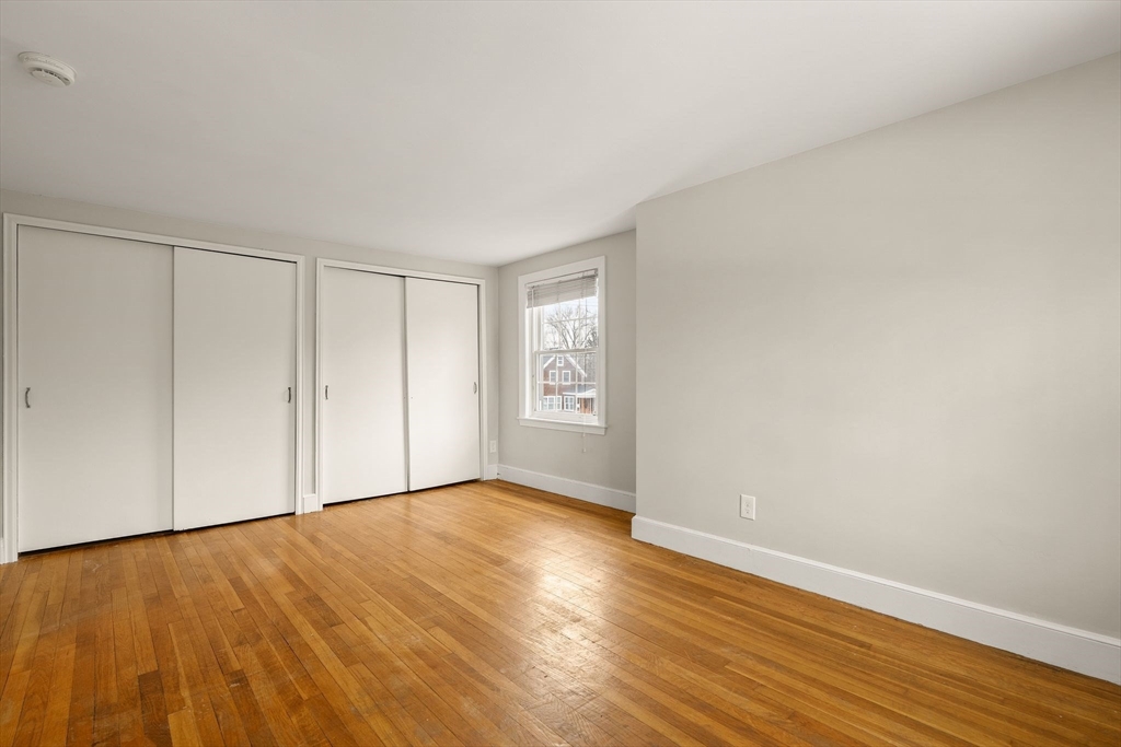 630 Pleasant Street Canton, MA 02021 - Photo 23 of 31 a view of an empty room with wooden floor