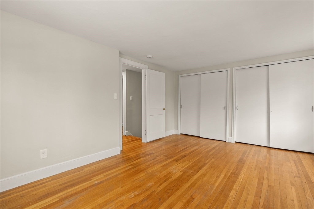 630 Pleasant Street Canton, MA 02021 - Photo 24 of 31 a view of an empty room with wooden floor