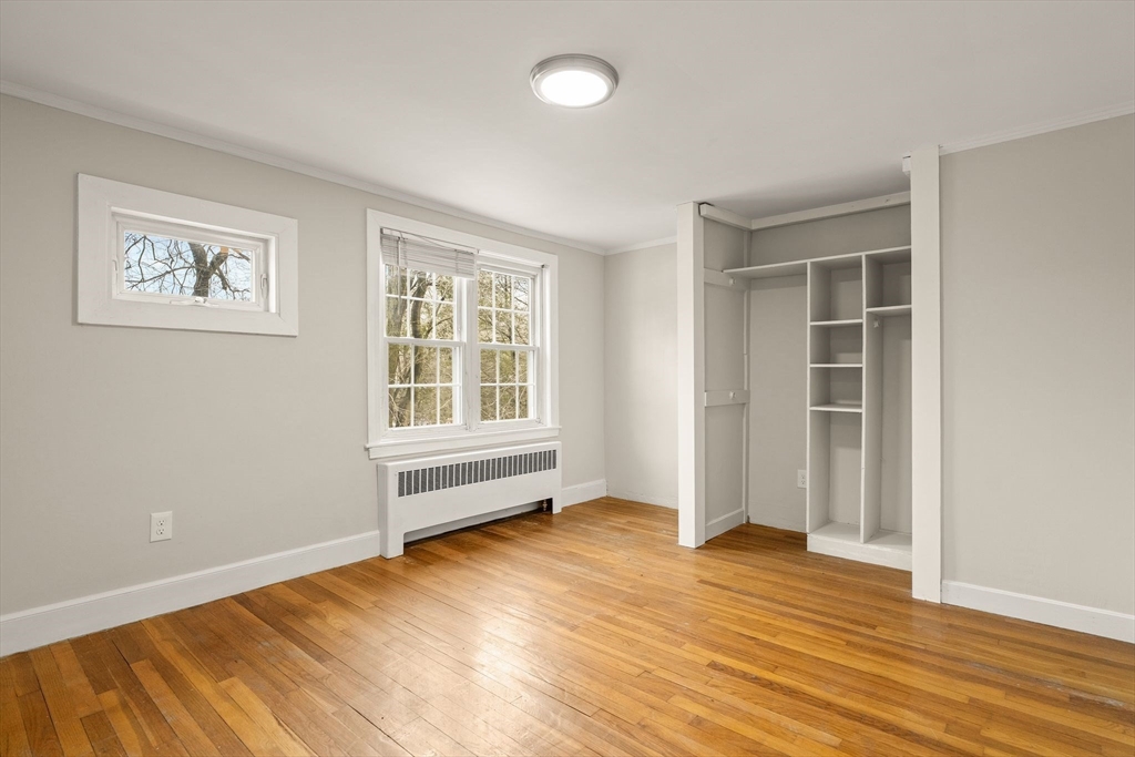 630 Pleasant Street Canton, MA 02021 - Photo 26 of 31 an empty room with wooden floor and windows