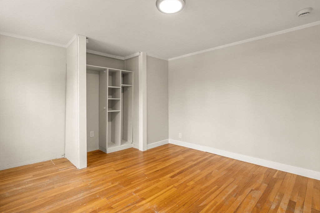 630 Pleasant Street Canton, MA 02021 - Photo 27 of 31 a view of empty room with wooden floor and fan