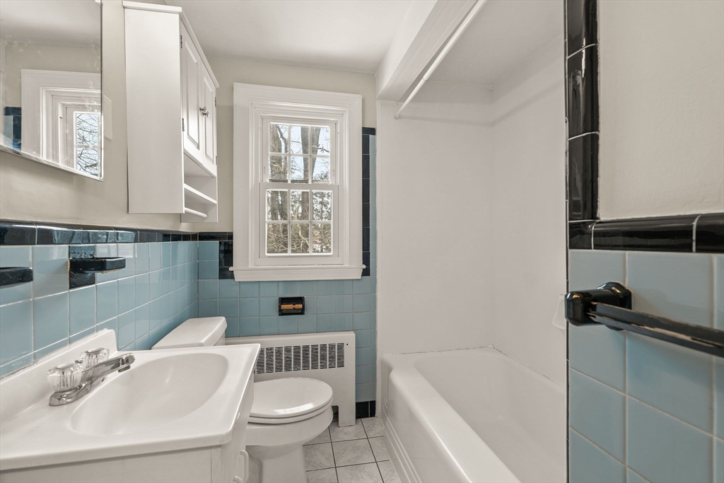 630 Pleasant Street Canton, MA 02021 - Photo 29 of 31 a bathroom with a sink a toilet and bathtub